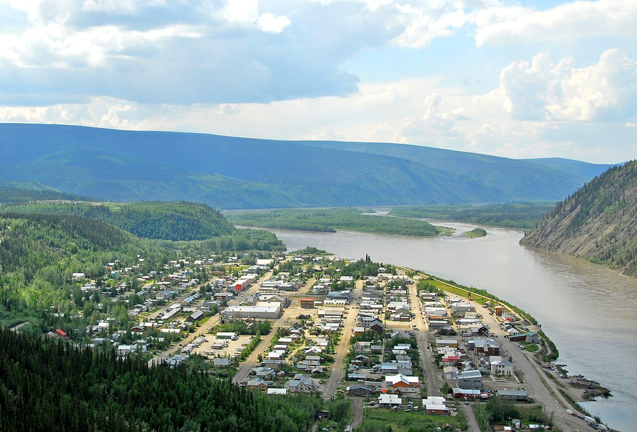 Overview of Dawson City and the Yukon River (regional lodging-upgrade context, not a hotel)